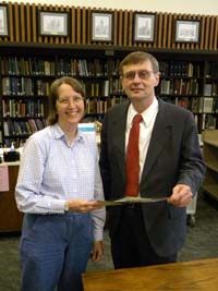 Archivist Debra Basham accepts donation from DNR District Administrator Bob Beanblossom