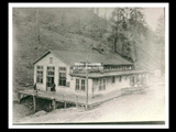 Store at mine Number 253 with wagon beside and two miners in front, one carrying a pail. Notation on folder identifies it as Thelma Number 6, Virginia Seaboard Mines. This picture is also found in the DeHaven Collection, Roll 1599 12.