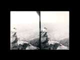 Woman (Alice) laying on rock looking down from cliff above Brown's. Stereo.