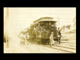 Car No. 29 at South Side Park in Fairmont with people onboard. Includes baseball players, probably from Fairmont.