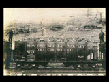 Monongahela Valley Traction Company coal car No. 708 at Stafford Mine. Two men standing on adjoining cars.