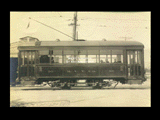 Monongahela Valley Traction Company car No. 90 at Fairmont barn. Brick street.