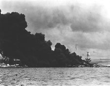 USS Arizona burning