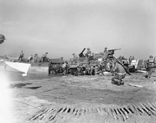 American fighting men pour out of their landing ships